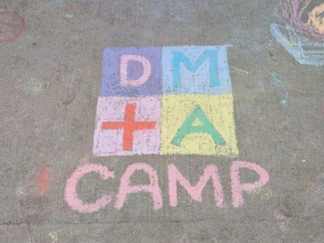 DMA CAMP Chalk Mural made of colourful chalk on a concrete driveway