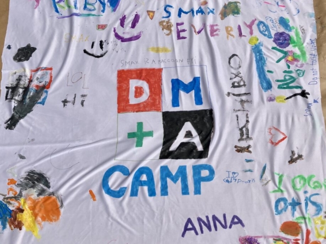 DMA CAMP Fabric Mural made by campers with colourful paint